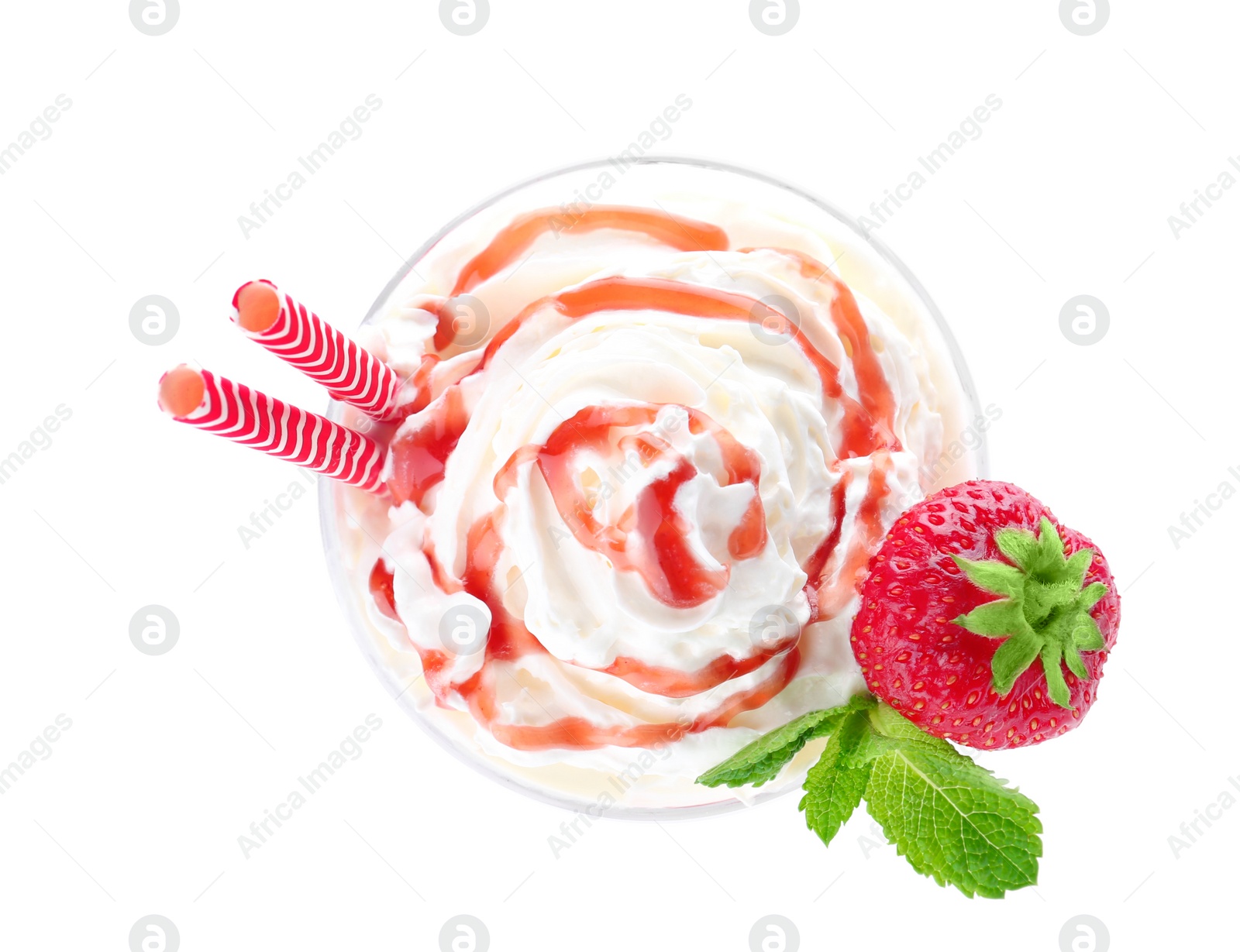 Photo of Glass of delicious milk shake with whipped cream and strawberry on white background, top view