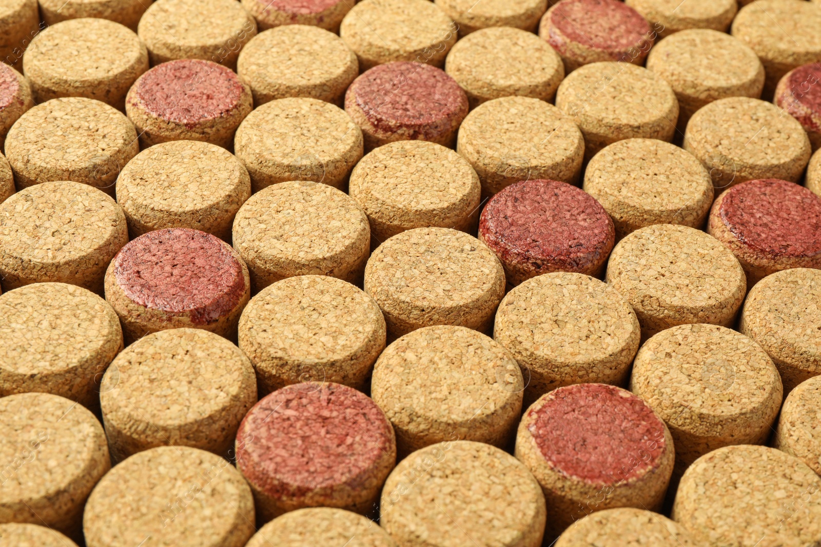 Photo of Many wine bottle corks as background, closeup