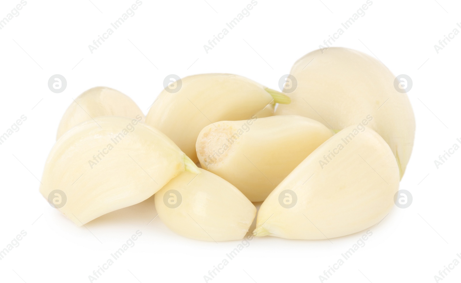 Photo of Peeled cloves of fresh garlic isolated on white