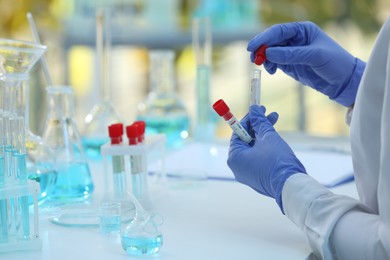 Photo of Scientist working with samples in laboratory, closeup. Medical research