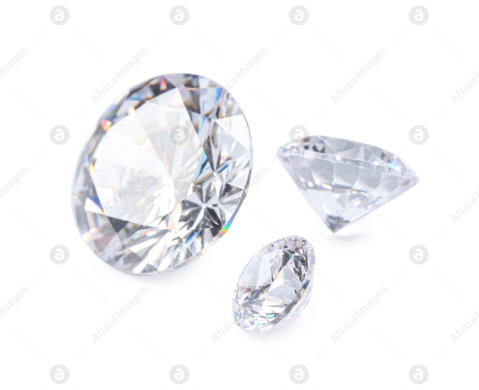 Photo of Different beautiful shiny diamonds isolated on white