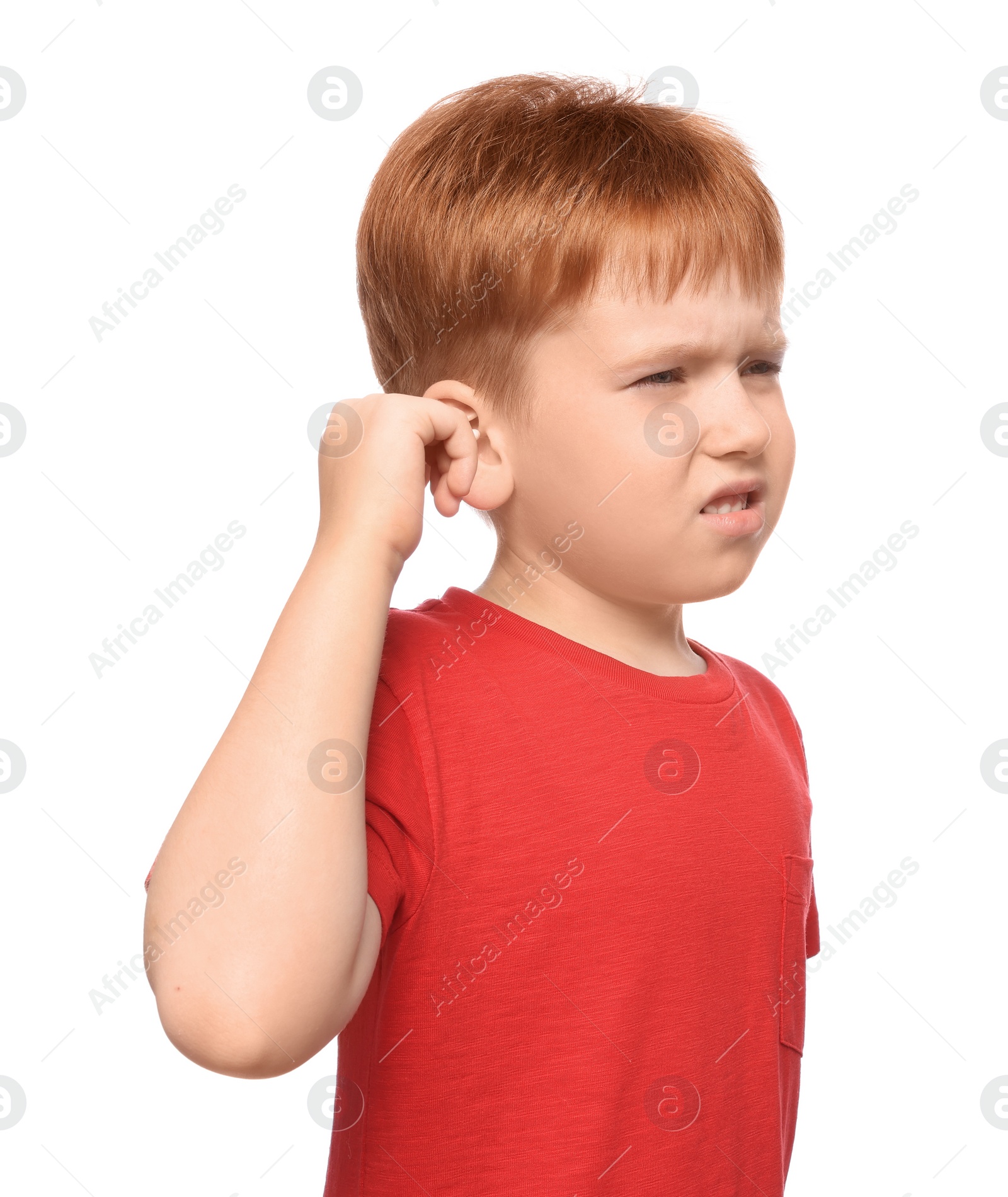 Photo of Little boy suffering from ear pain on white background