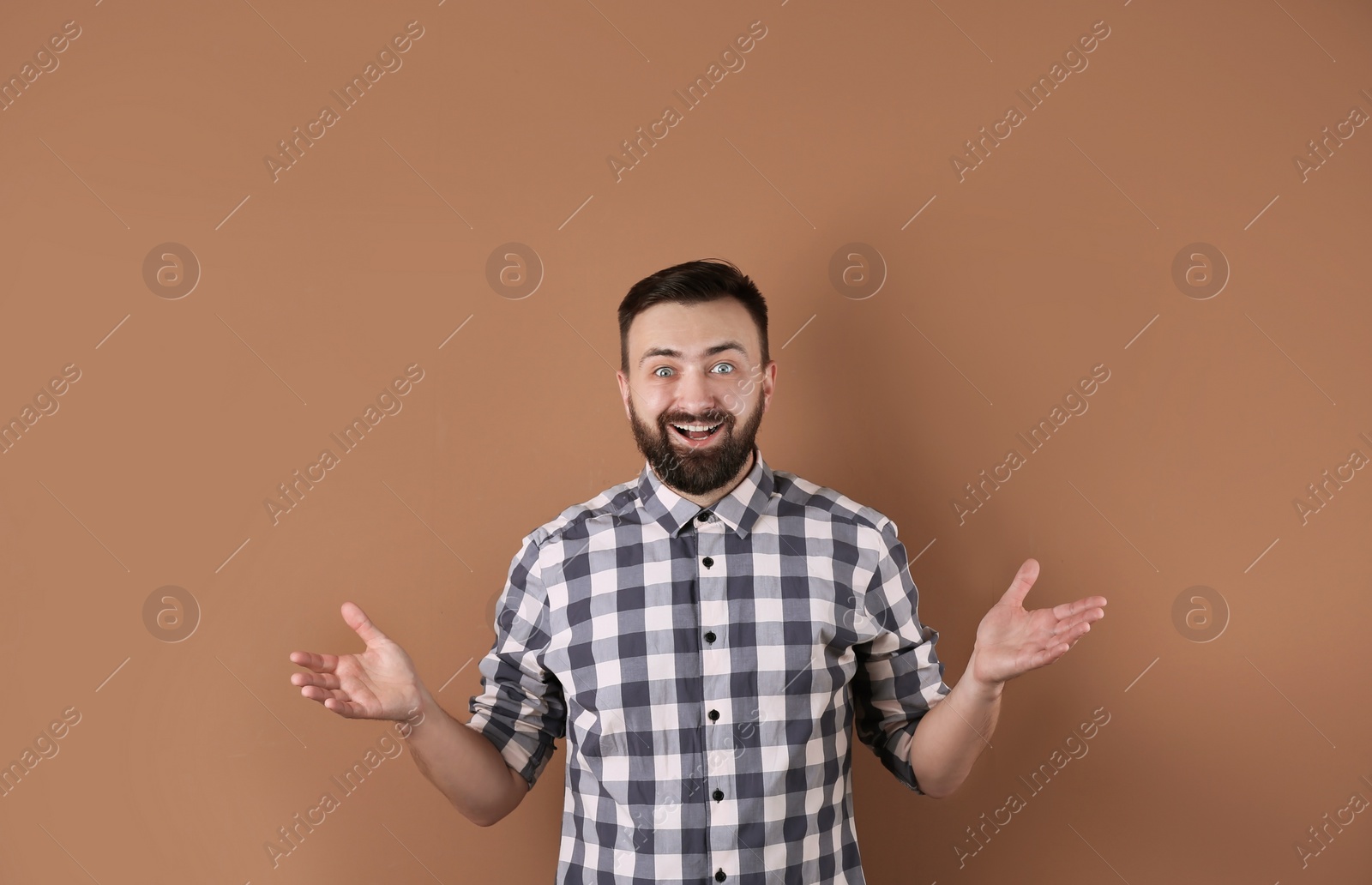 Photo of Portrait of handsome bearded man on color background