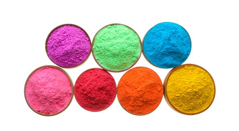 Photo of Colorful powders in bowls on white background, top view. Holi festival celebration