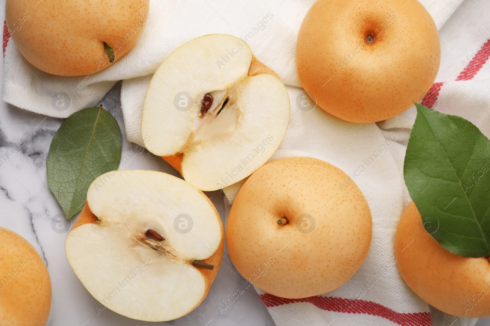 Photo of Delicious apple pears on white marble table, flat lay