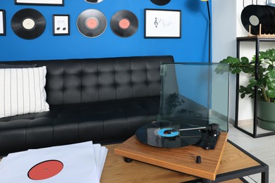 Photo of Living room decorated with vinyl records. Interior design