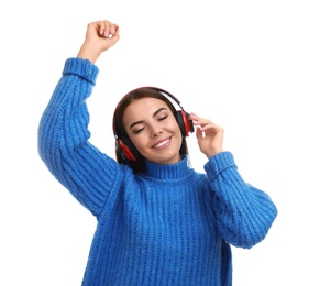 Photo of Young woman listening to music with headphones on white background