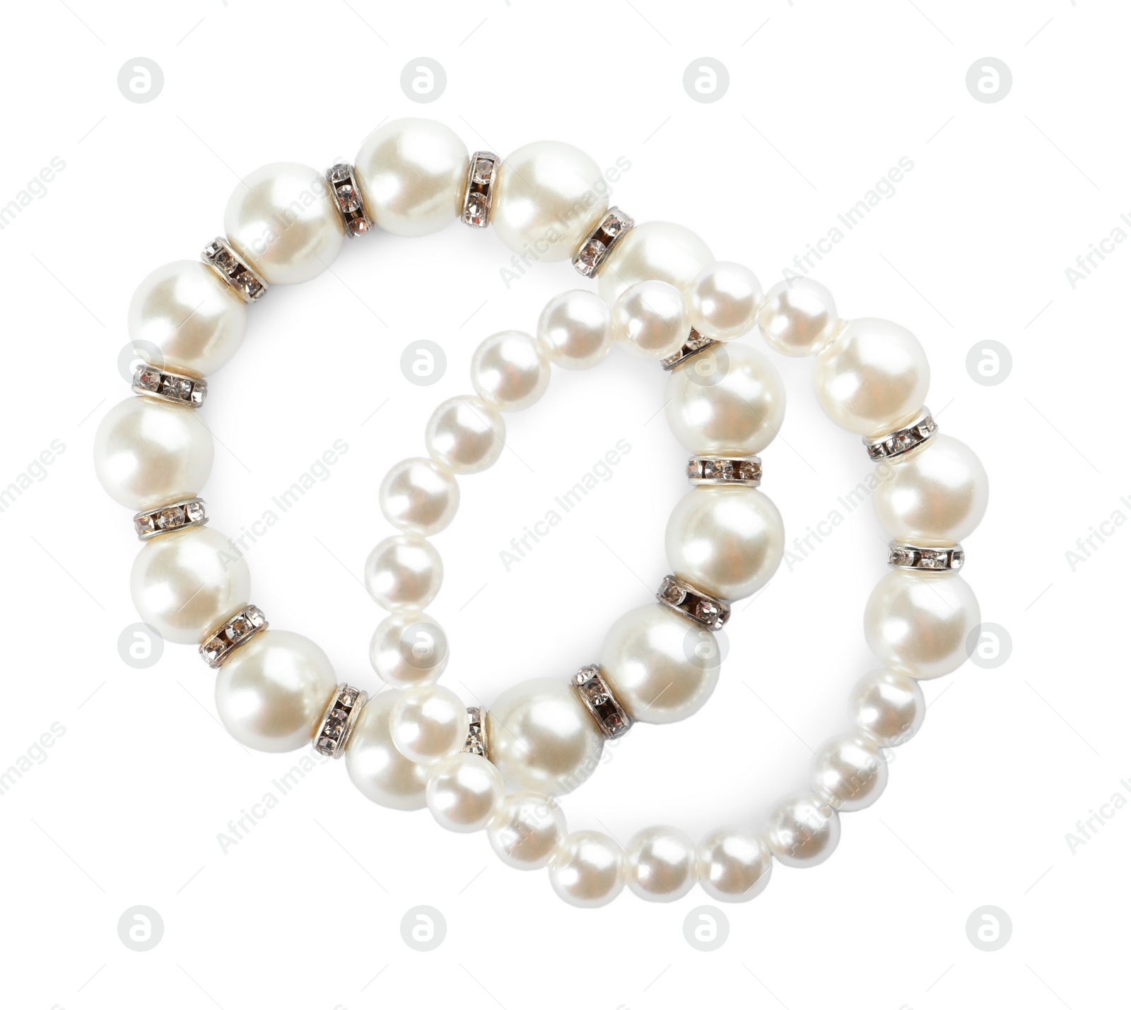 Photo of Elegant pearl bracelets on white background, top view