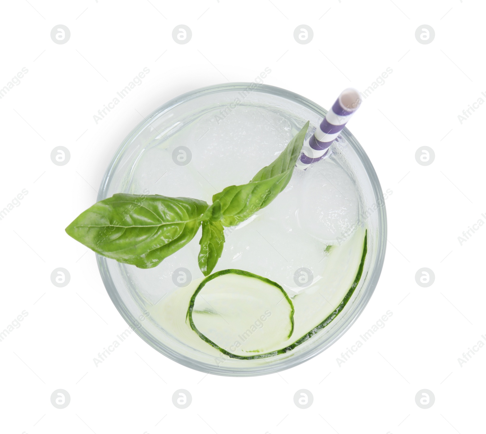 Photo of Refreshing cucumber water with basil in glass isolated on white, top view