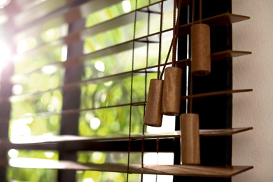 Photo of Closeup view of sunlit horizontal window blinds