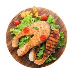 Wooden board with tasty salmon steak on white background