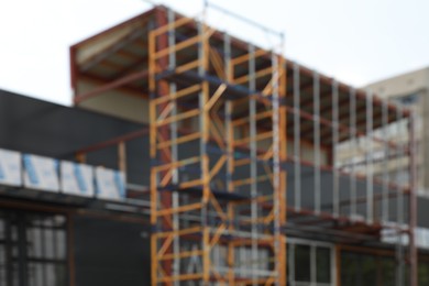 Blurred view of new building exterior with scaffolding