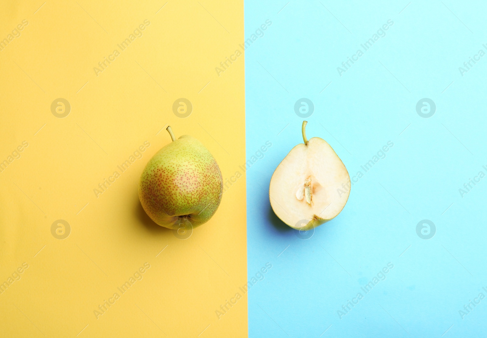 Photo of Ripe juicy pears on color background, flat lay