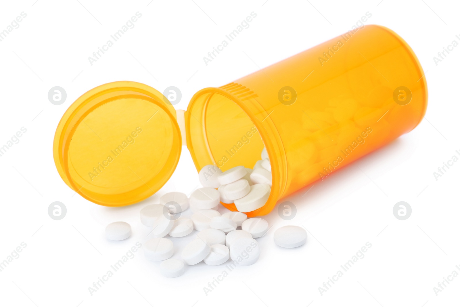 Photo of Scattered pills and open container isolated on white