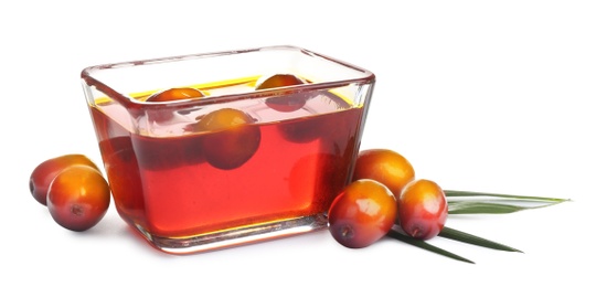 Palm oil in glass bowl and fruits on white background. Banner design