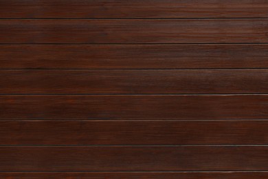Texture of wooden board on black background, top view