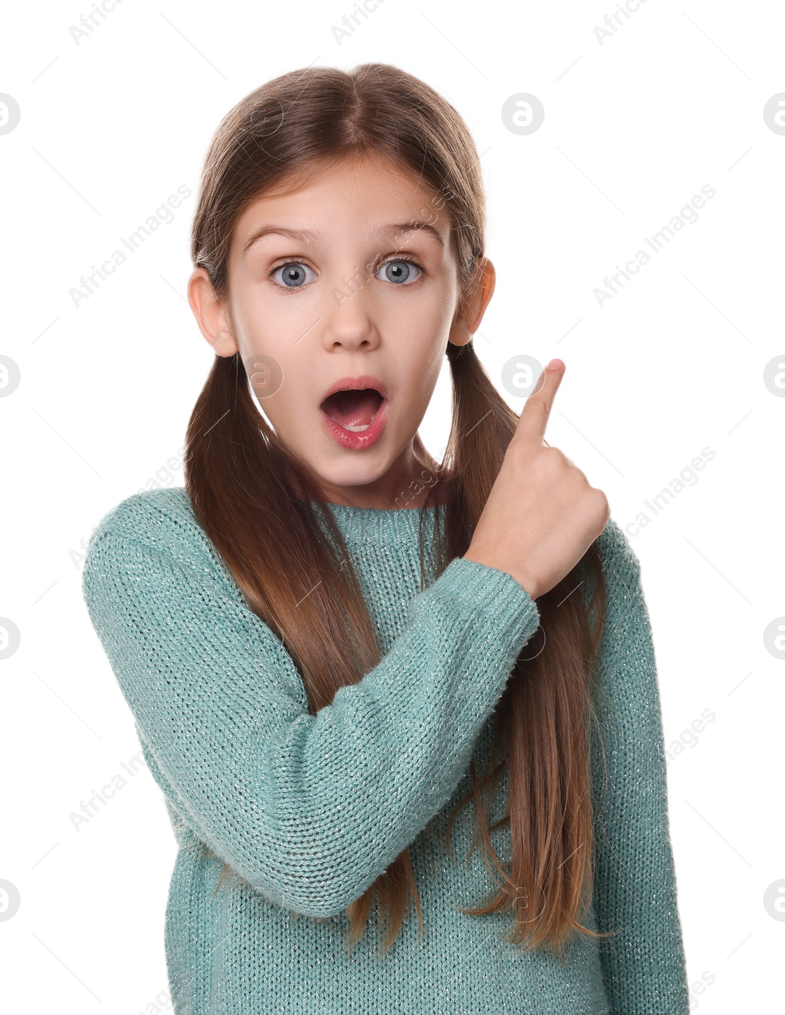 Photo of Surprised girl pointing at something on white background