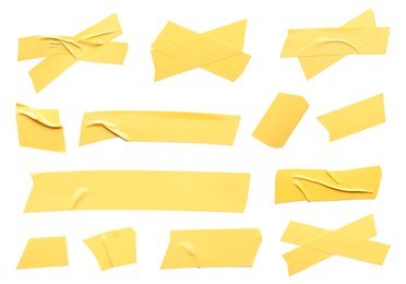 Image of Collage with pieces of yellow insulating tape on white background, top view