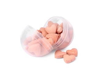 Photo of Heart shaped vitamins with container for pets isolated on white