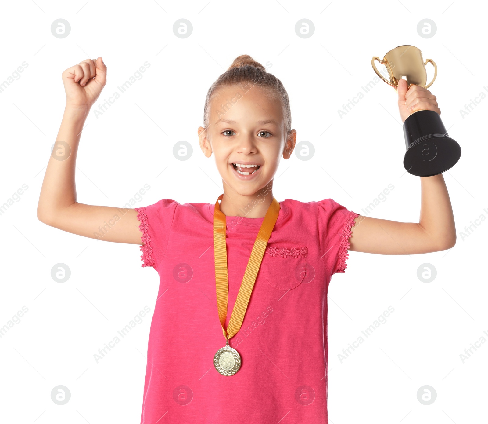 Photo of Happy girl with golden winning cup and medal on white background