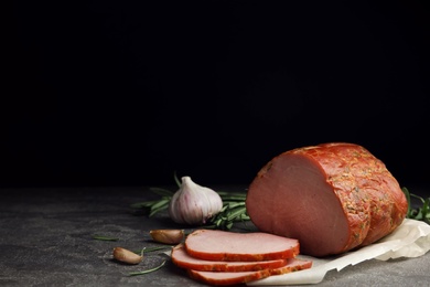 Photo of Delicious ham on grey table, space for text. Christmas dinner