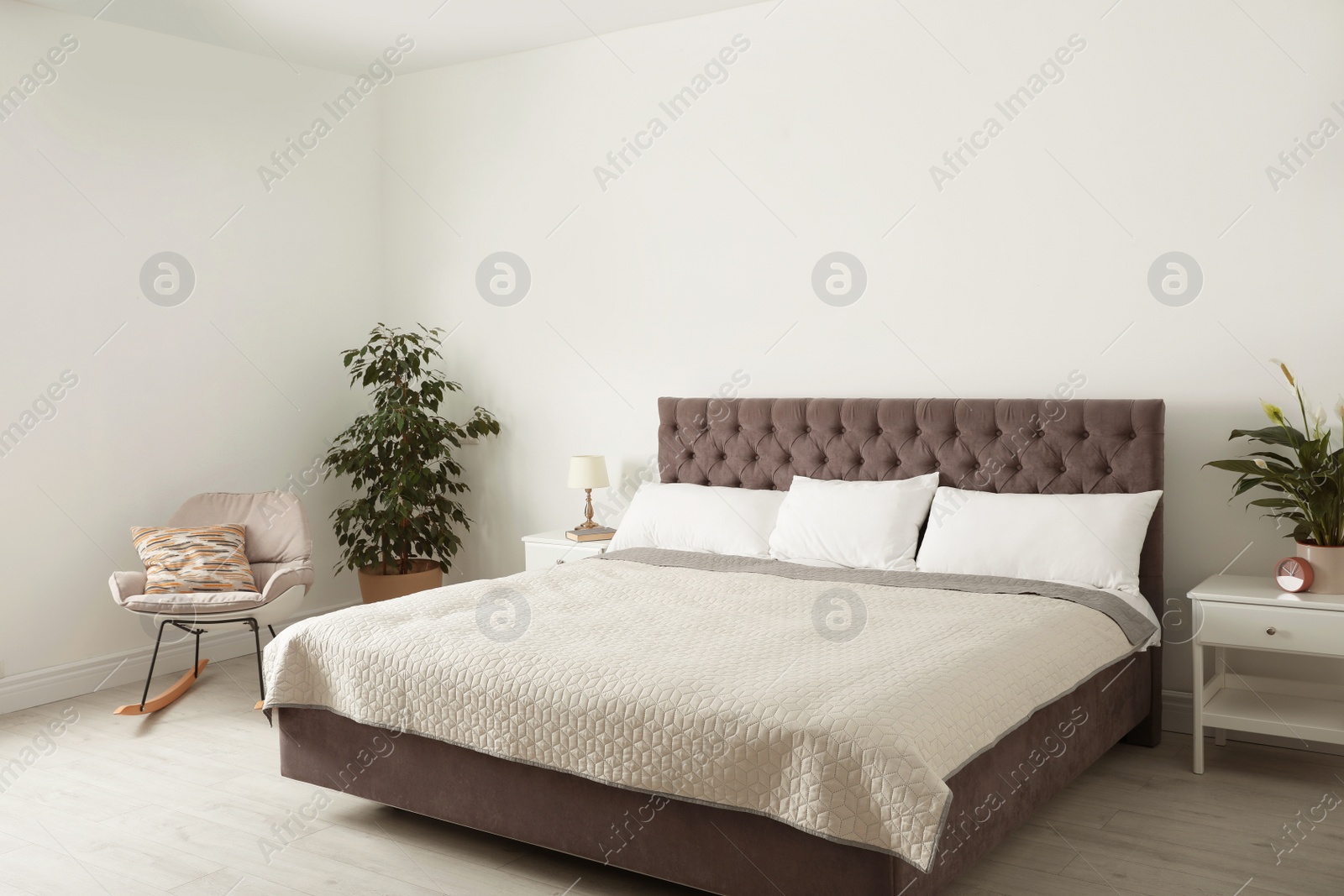 Photo of Elegant interior of contemporary bedroom with plants