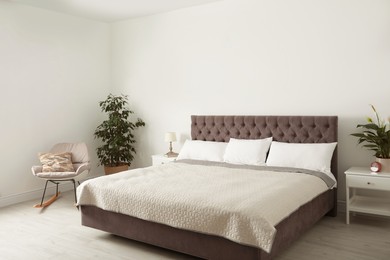 Photo of Elegant interior of contemporary bedroom with plants