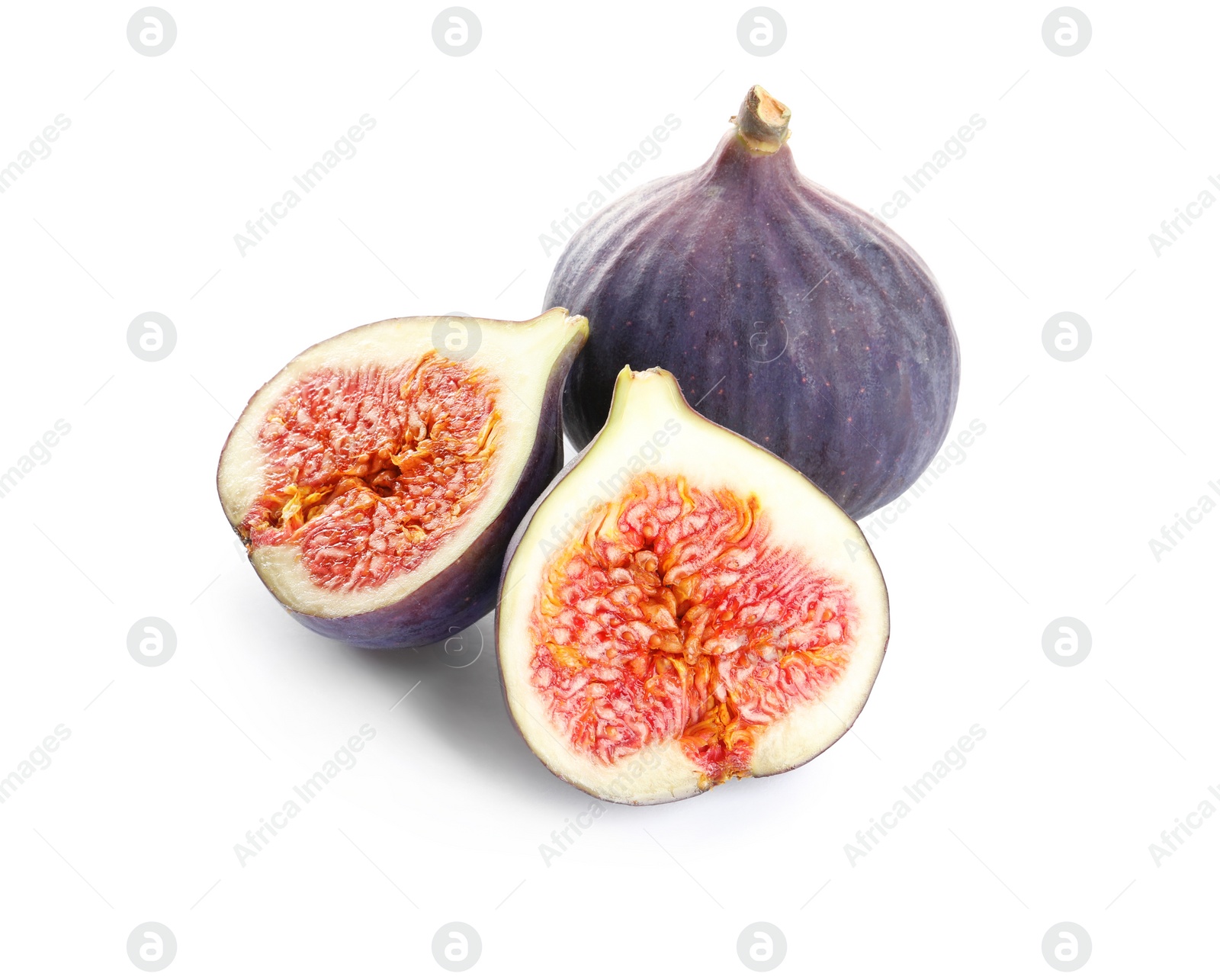 Photo of Whole and cut purple figs on white background