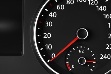 Photo of Speedometer on modern car dashboard, closeup view