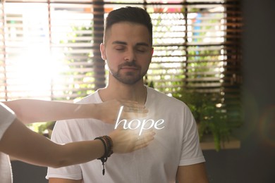 Image of Concept of hope. Young man during healing session