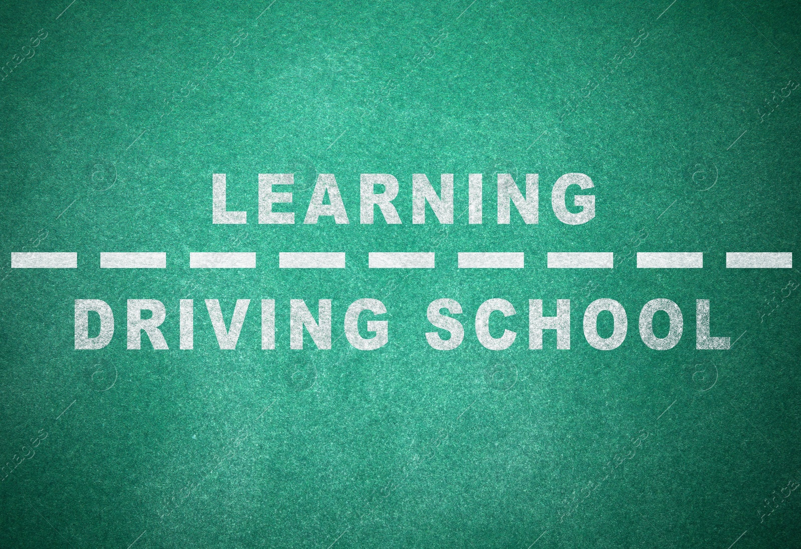 Image of Driving school concept. Text and dashed line on green chalkboard 