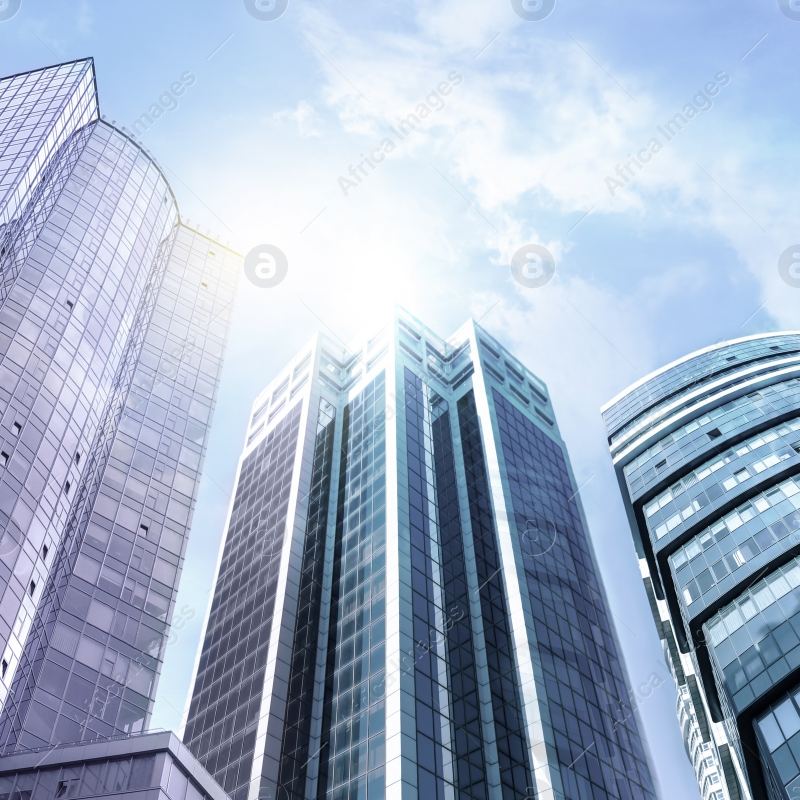 Image of Office buildings with tinted windows, low angle view. Modern architectural corporation 