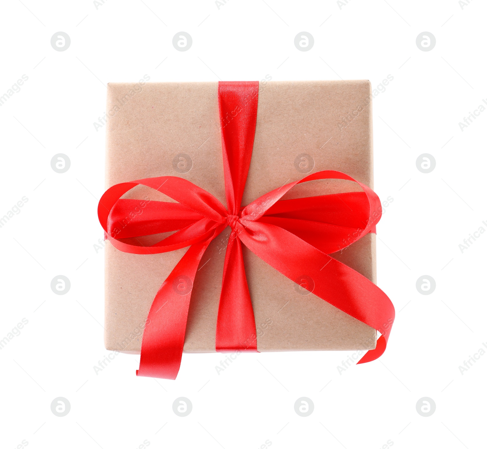 Photo of Christmas gift box decorated with ribbon bow on white background, top view