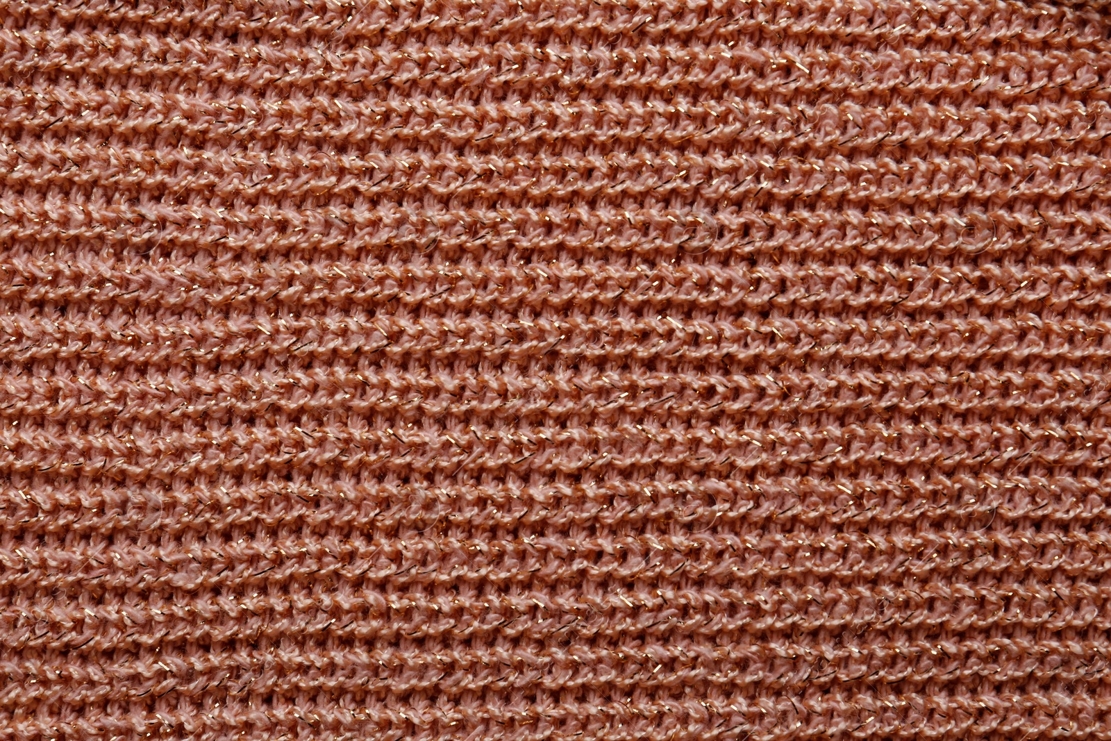 Photo of Brown knitted fabric as background, top view