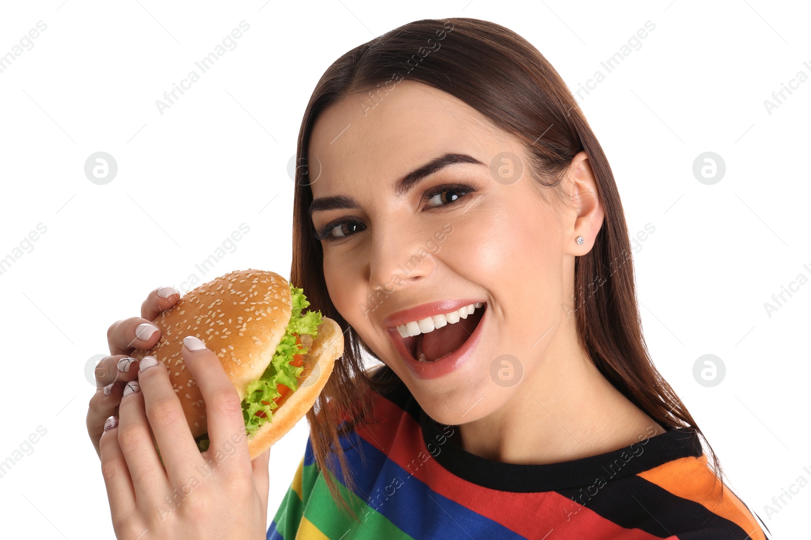 Photo of Young woman eating tasty burger on white background