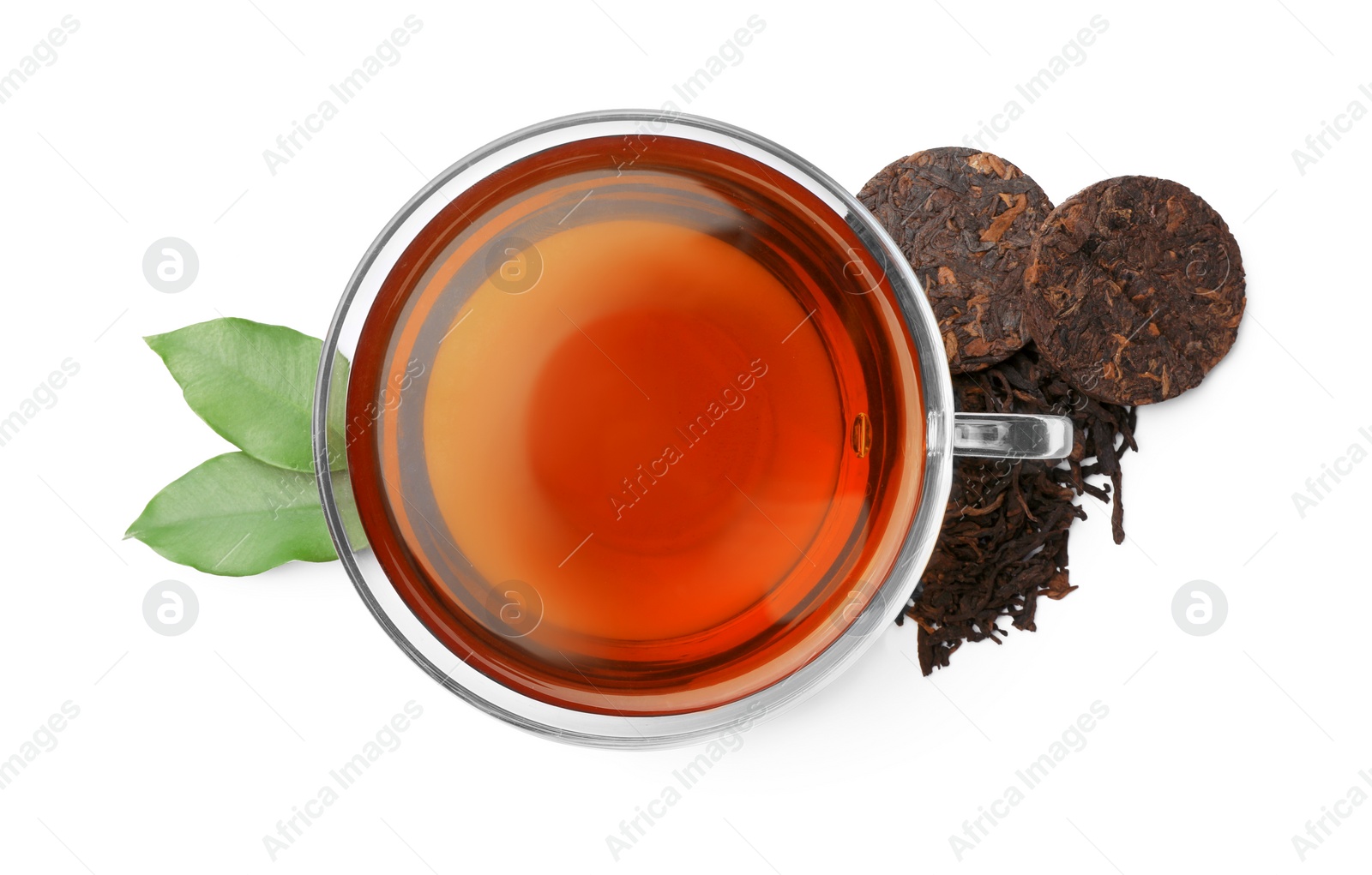 Photo of Traditional Chinese pu-erh tea, freshly brewed beverage and green leaves isolated on white, top view