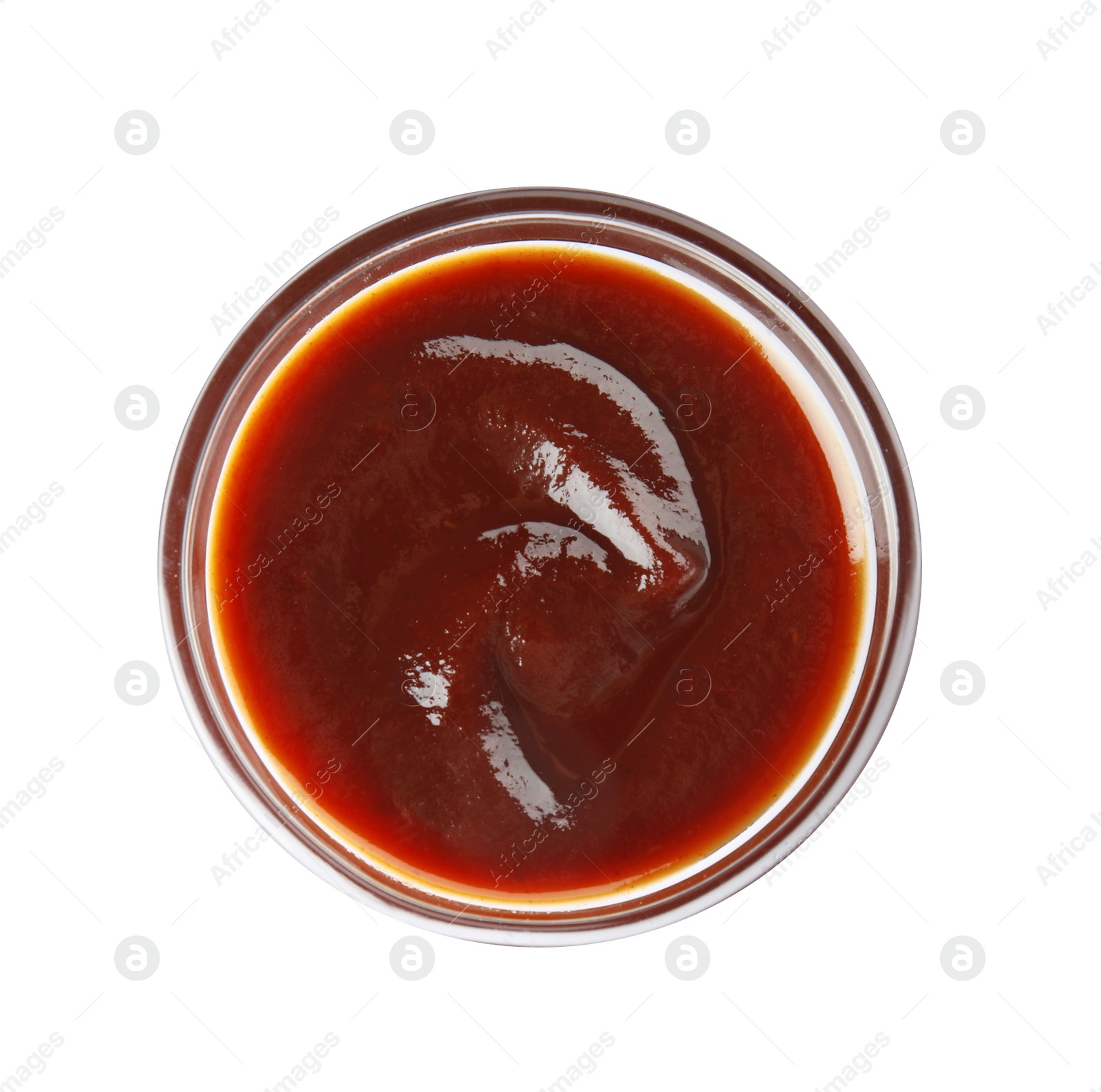 Photo of Glass bowl of barbecue sauce on white background, top view