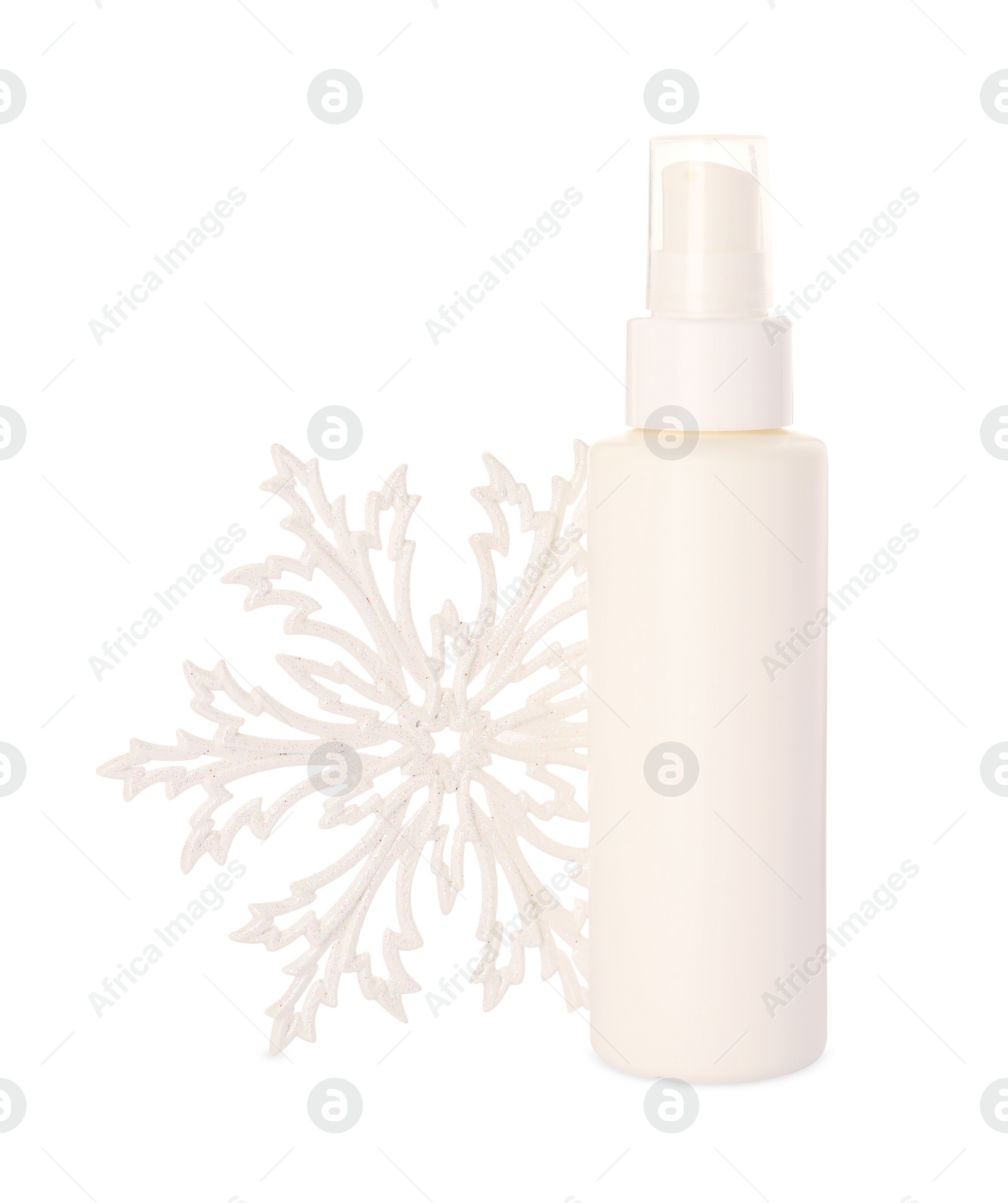 Photo of Bottle of hand cream and snowflake isolated on white. Winter skin care
