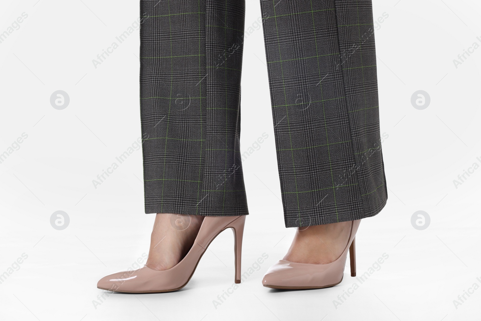 Photo of Businesswoman in beige shoes on white background, closeup