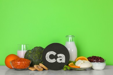 Photo of Food high in calcium. Different products on white table