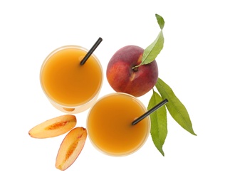 Photo of Freshly made tasty peach juice on white background, top view