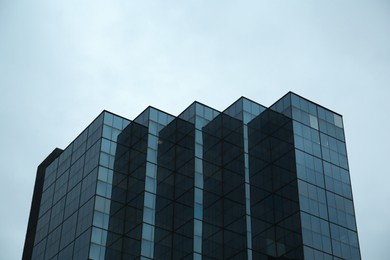 Modern buildings with many windows under beautiful sky