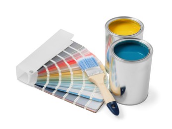 Photo of Paint cans, brush and palette on white background