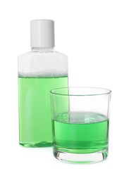 Bottle and glass of mouthwash isolated on white