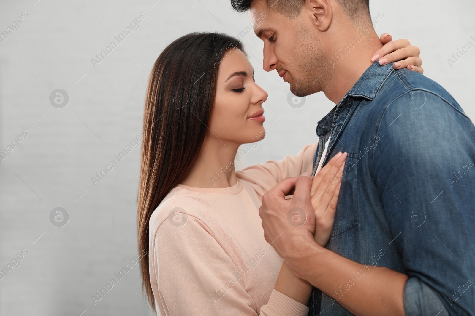 Photo of Happy young couple dancing together at home