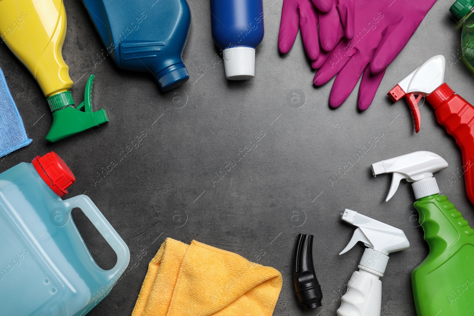 Photo of Frame of many different car cleaning products on dark background, flat lay. Space for text