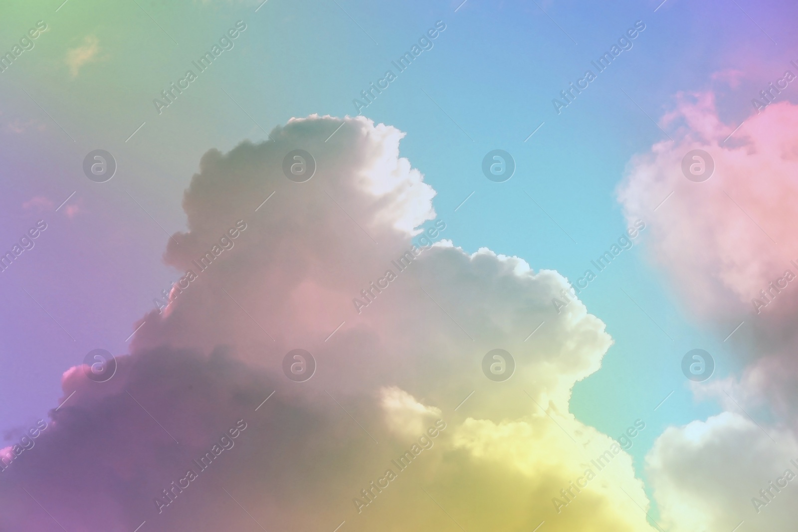 Image of Fantasy world. Picturesque view of beautiful magic sky with fluffy clouds, toned in pastel rainbow or unicorn colors