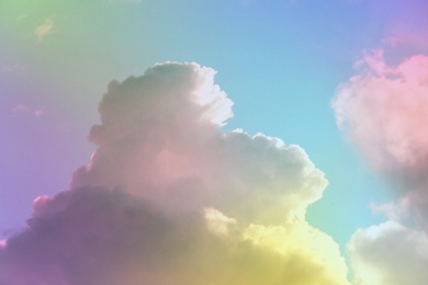 Image of Fantasy world. Picturesque view of beautiful magic sky with fluffy clouds, toned in pastel rainbow or unicorn colors