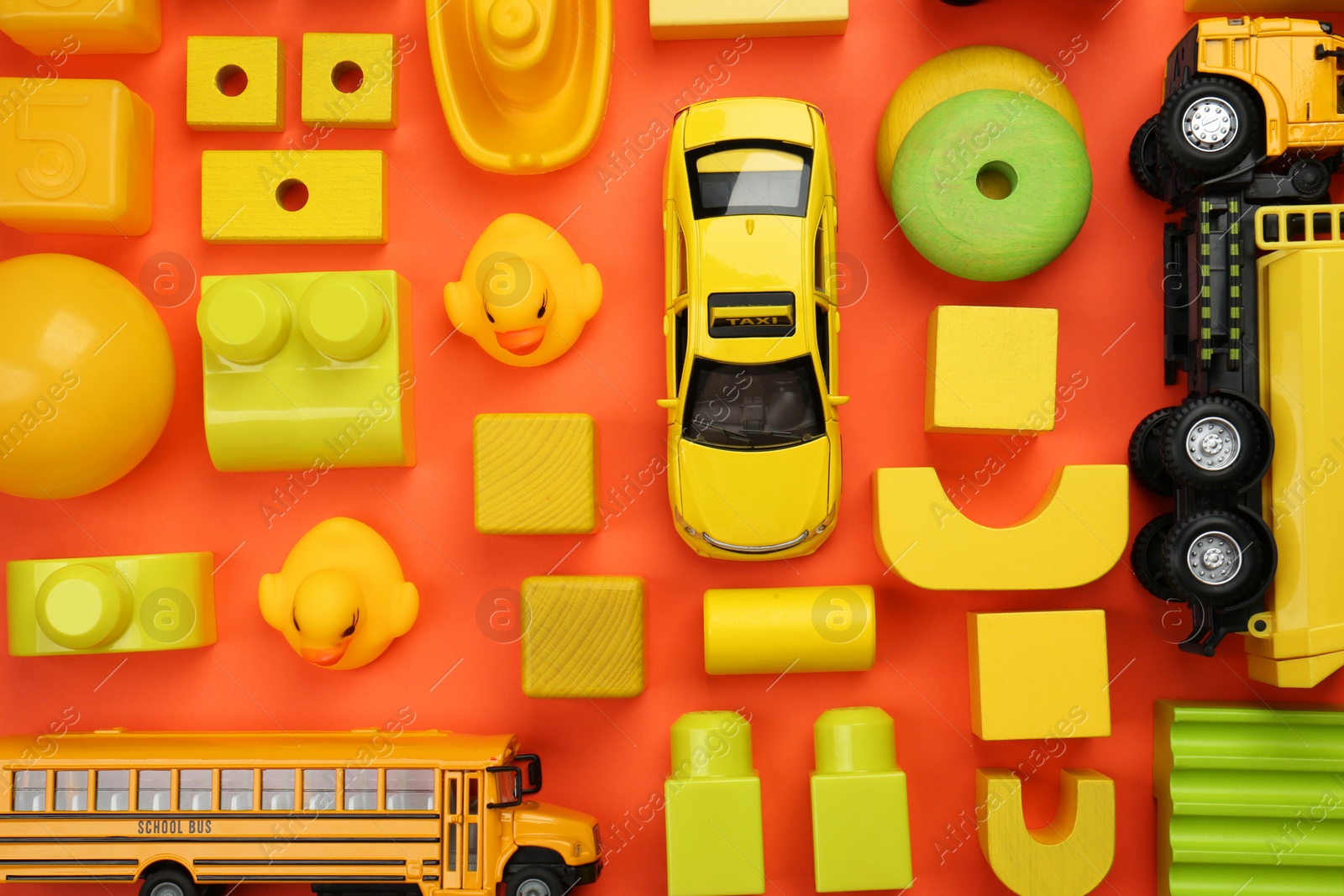 Photo of Different children's toys on orange background, flat lay