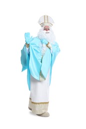 Photo of Full length portrait of Saint Nicholas holding sack with presents on white background